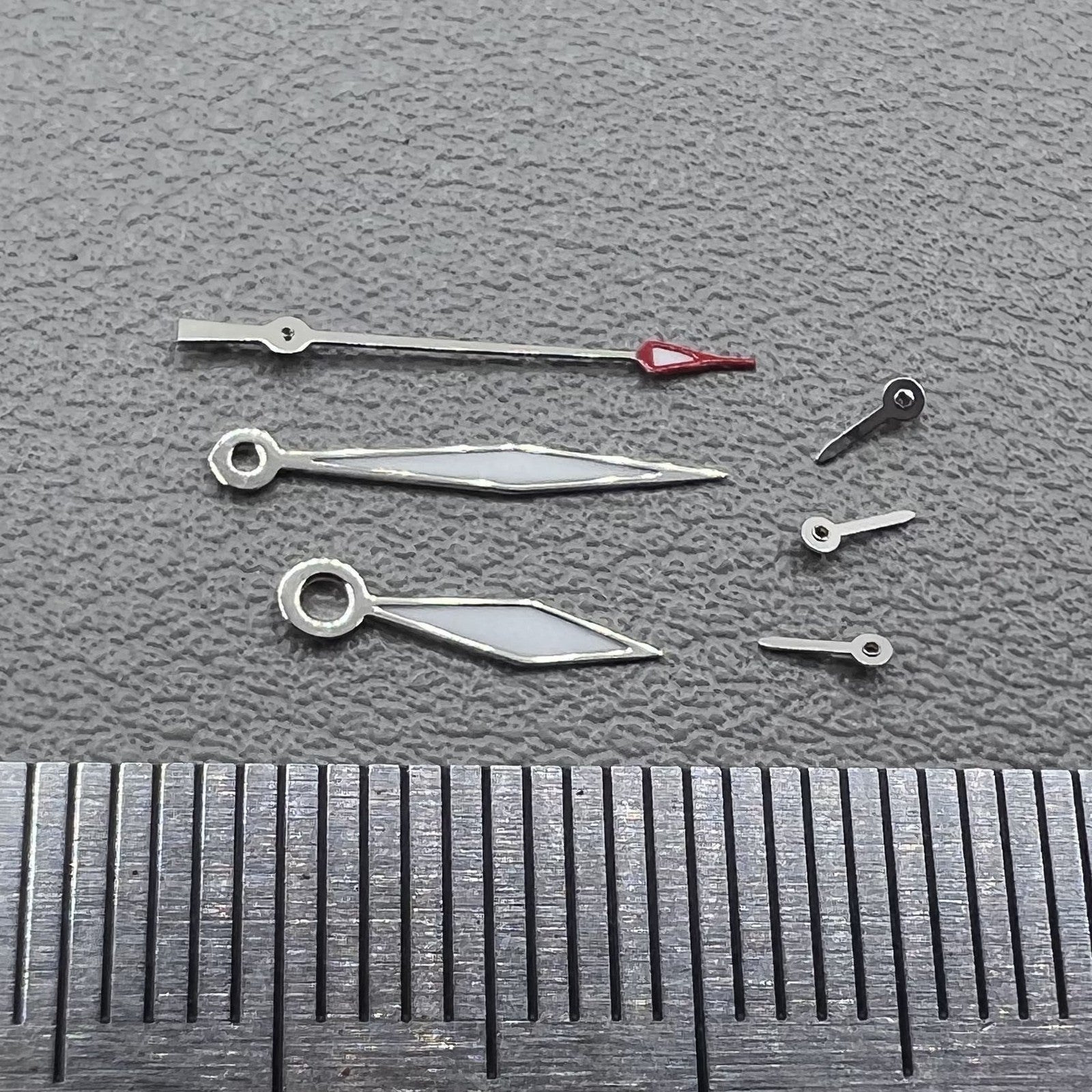 Set of 2 silver trim diamond-shaped lume hands for Miyota JS15 watch movement.