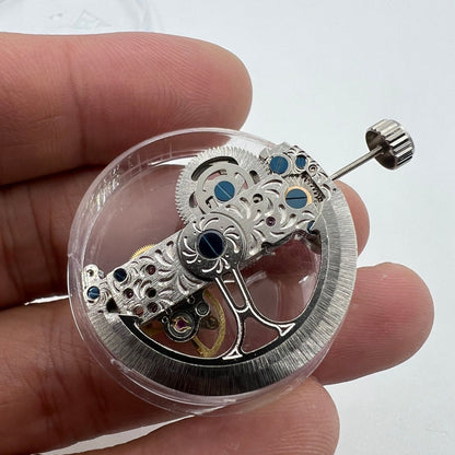 Silver long pendulum wheel watch accessory by Asian, showcasing automatic mechanical movement details