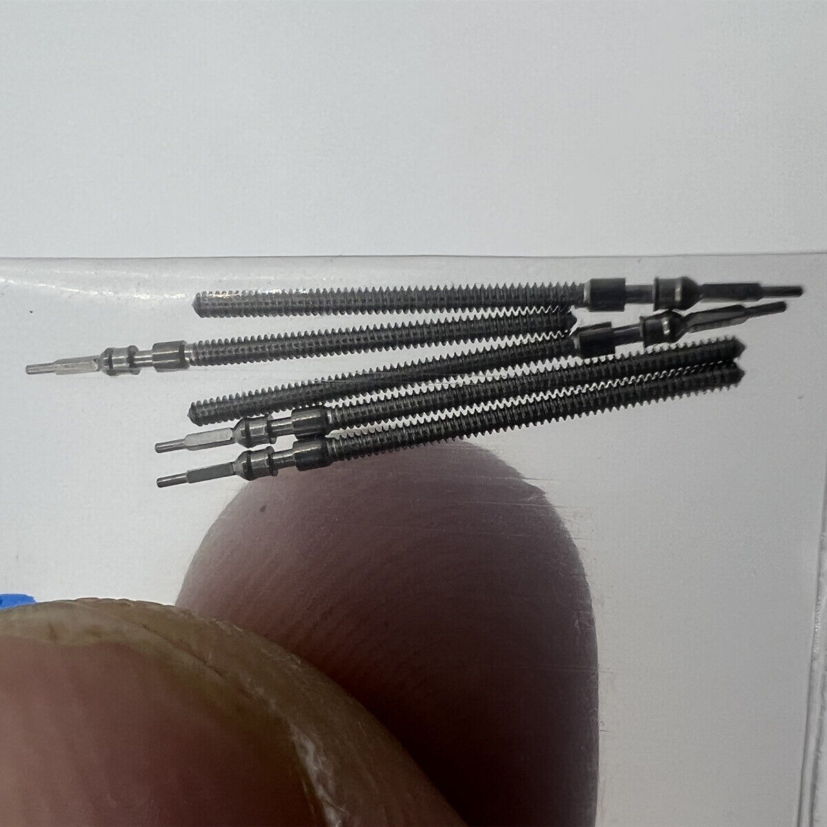 Precision watch winding stem compatible with Miyota 2115 and 2105 movements, ideal for repairs.