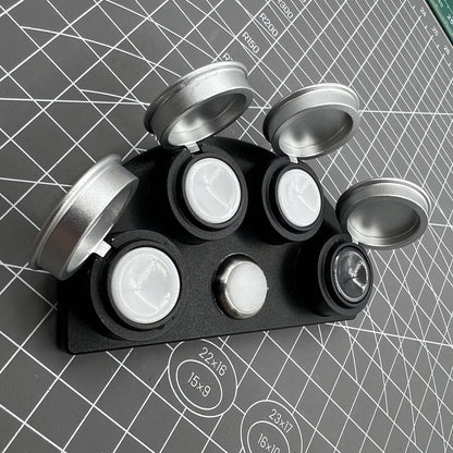 Die-cast alloy oil cup stand with 4 containers and black ceramic inserts for watch maintenance.