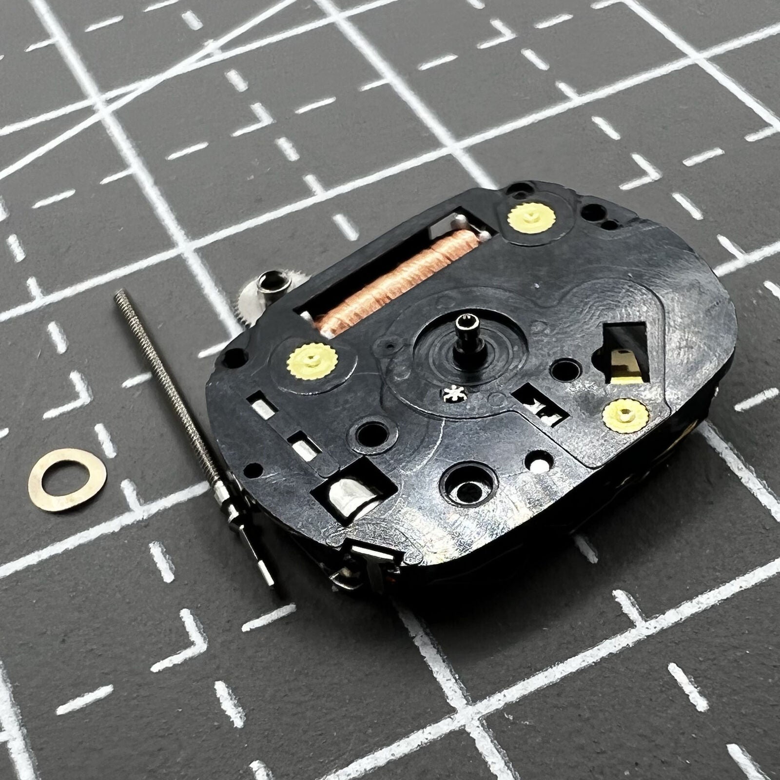 Hattori VX01 quartz watch movement with three hands, ideal for precise watch repairs and replacements.
