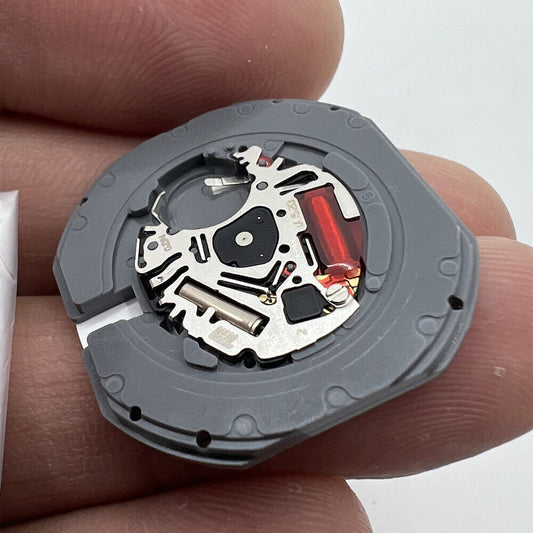 Hattori Epson TMI VJ52 quartz watch movement with date at 3 o'clock, precision Japanese craftsmanship.