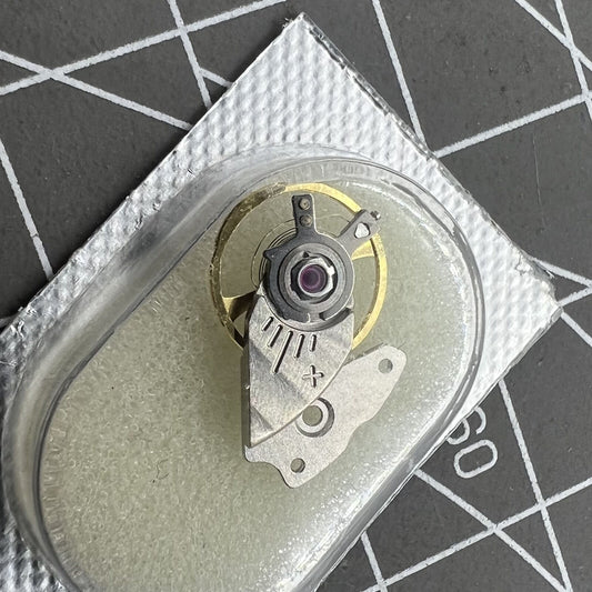 Original Miyota 9015 watch balance wheel with splint, precision Japanese movement component for watch repair.