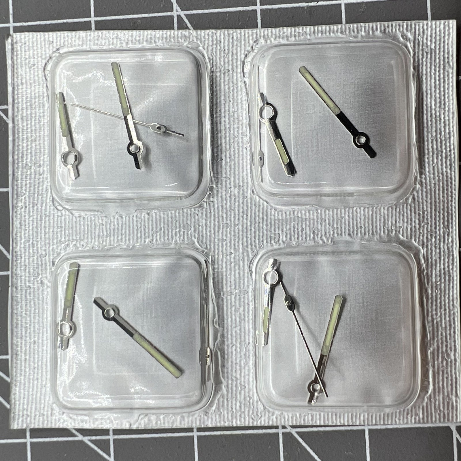 Golden and silver luminous watch hands for movement 7009 by Generic, enhancing time visibility in low light.