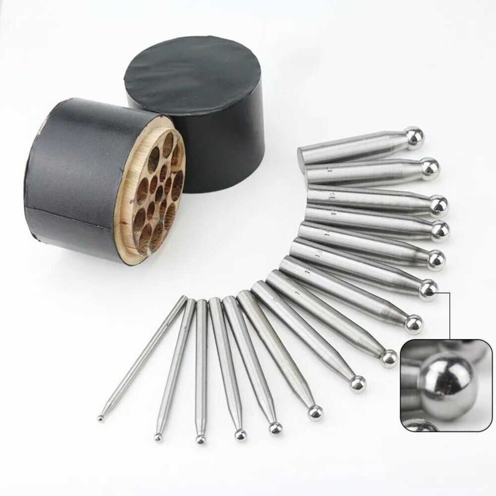 Shaping dapping punch set with wooden stand, ideal for jewelers and metalsmiths crafting detailed designs.