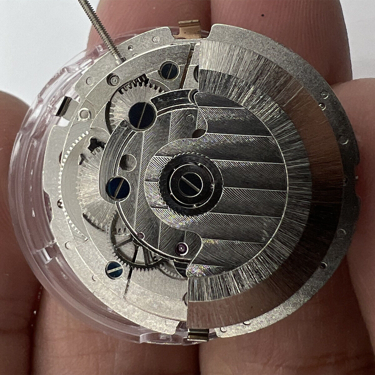 China Made Mechanical Automatic watch with 3 hands, big date at 12, multi-function dials for stylish timekeeping.