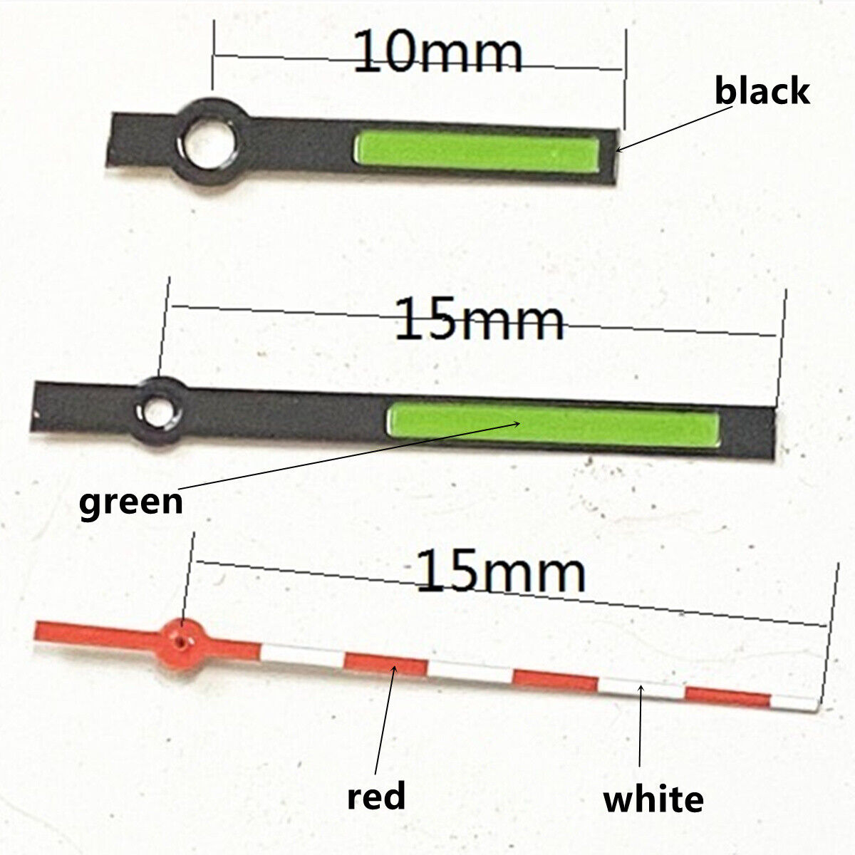 Black, red, and white trimmed watch hands with green lume for Ronda 515 quartz movement.