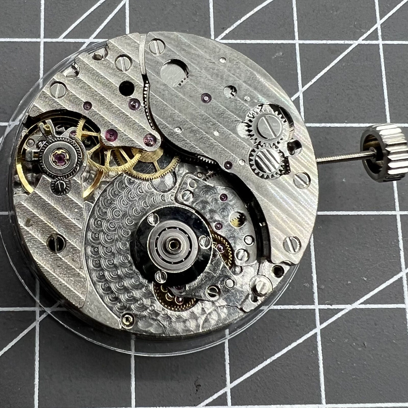 Hangzhou automatic kinetic watch movement with small second at 4, precise and rotor-free design.