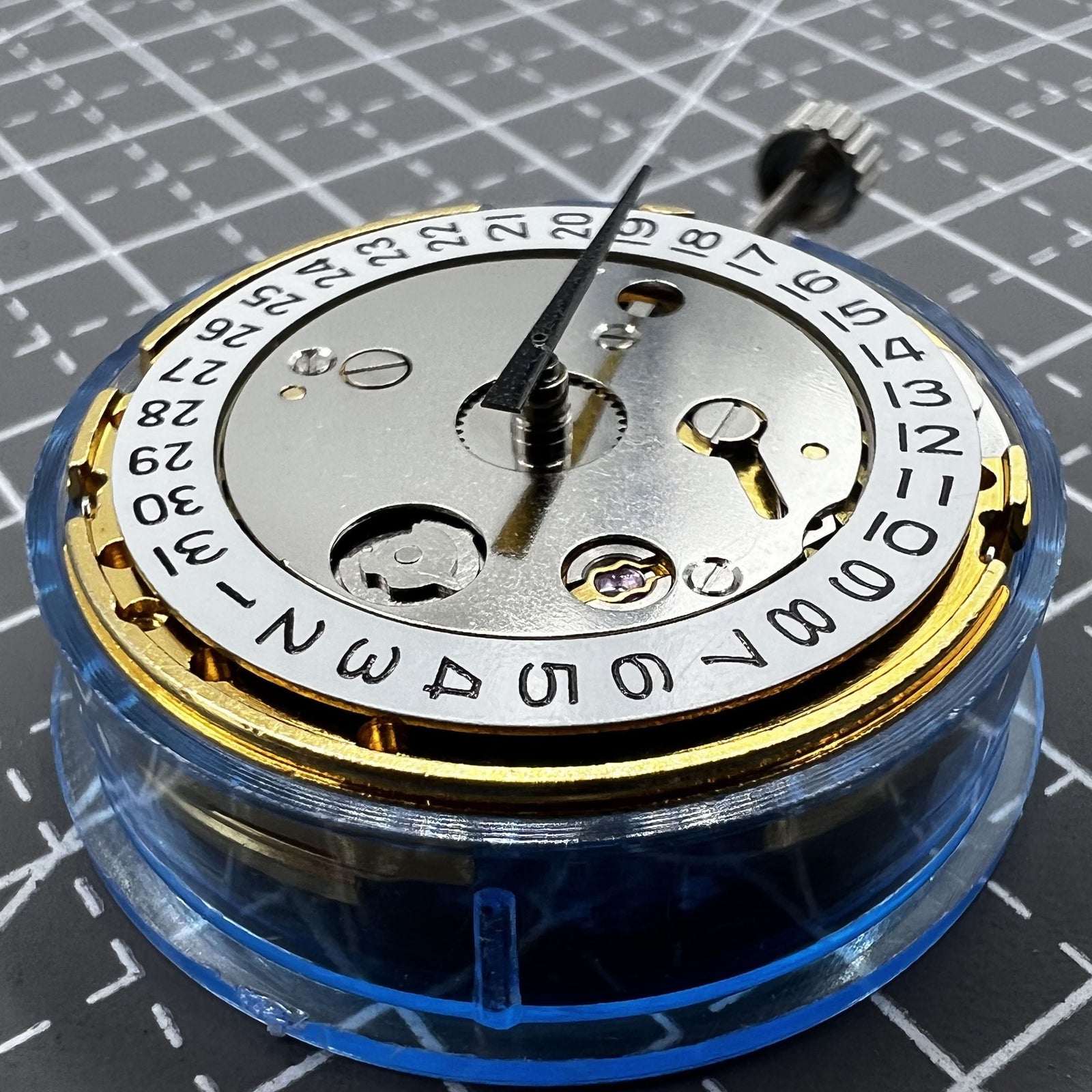 Polished gold Tianjin T16 mechanical watch movement, compatible with Miyota 8200, precision replacement part.