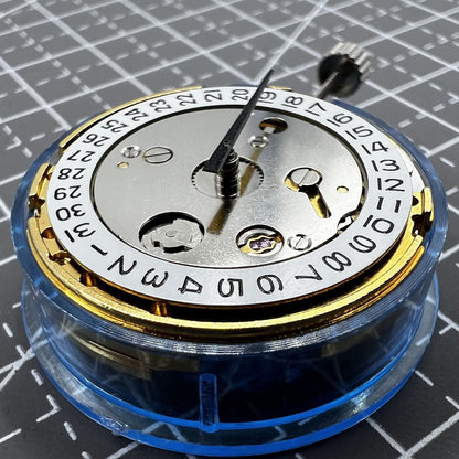 Polished gold Tianjin T16 mechanical watch movement, compatible with Miyota 8200, precision replacement part.