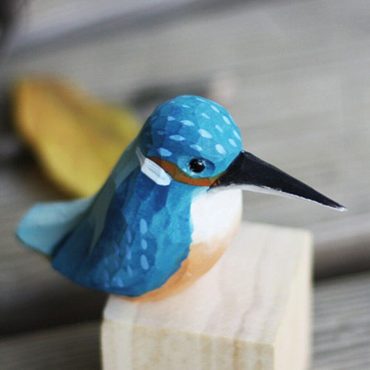Handmade blue bird wooden figurine, detailed collectible decorative artwork for home decor.