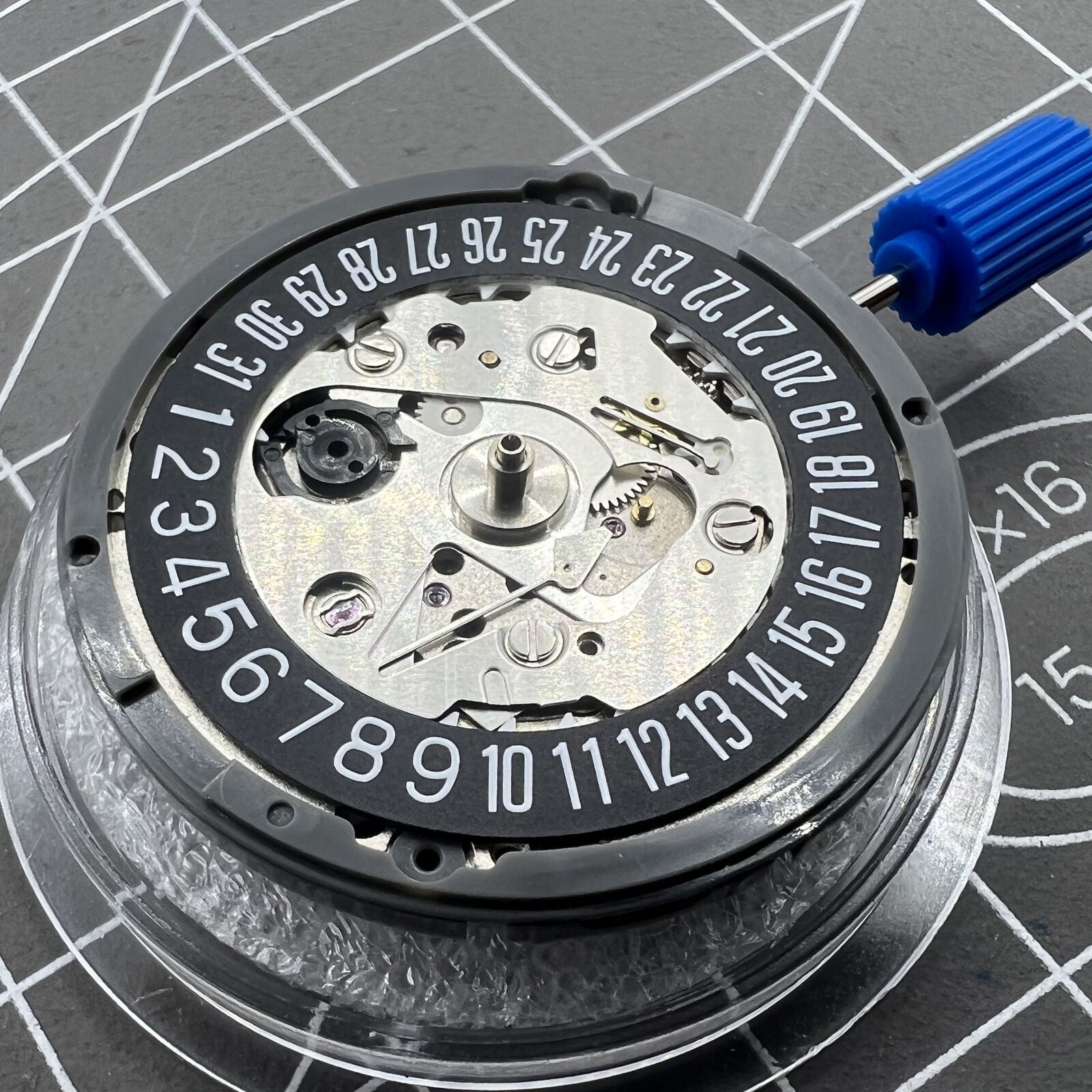 Black NH35 automatic watch movement with date at 6, precise self-winding mechanical by Seiko.