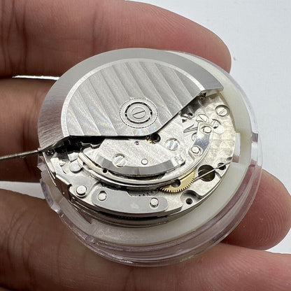 Close-up of China Made 7753 mechanical movement clone for Daytona watch accessories, precision gear details.