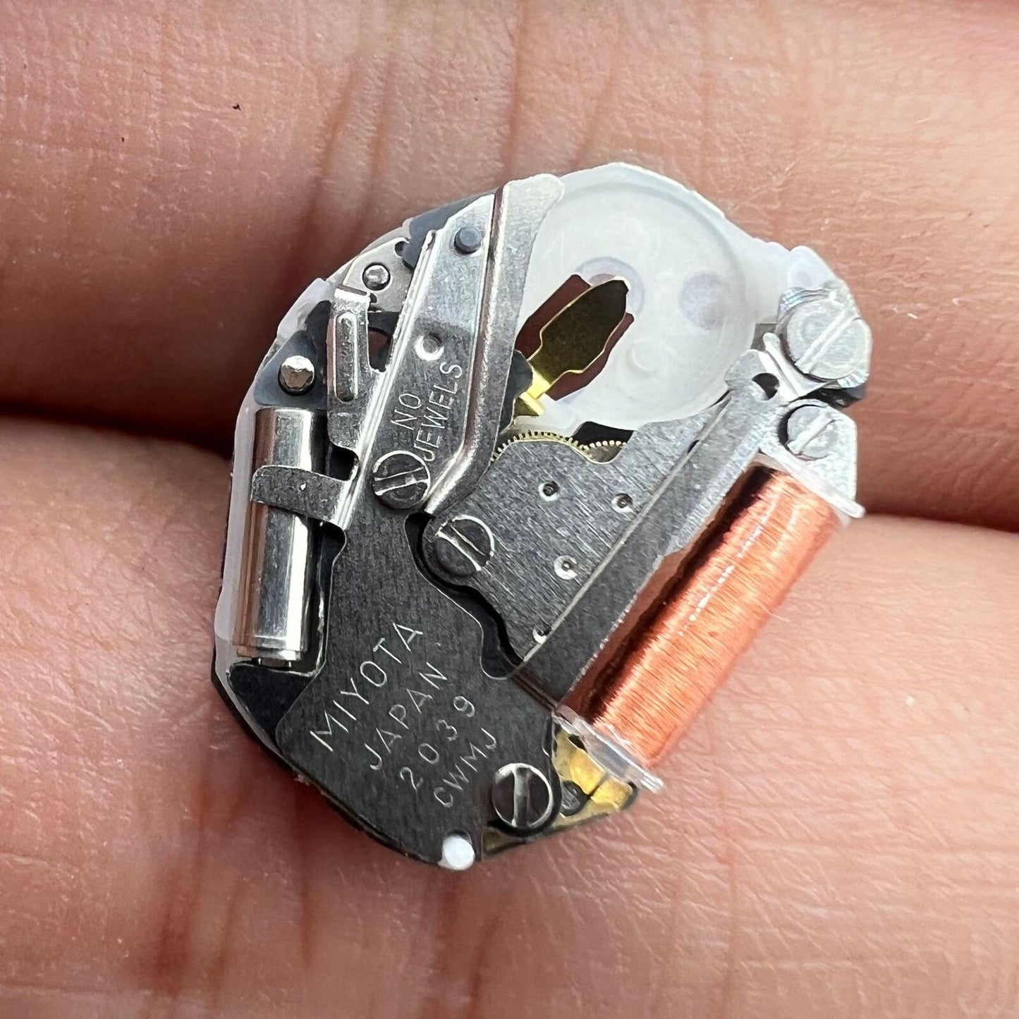 Miyota 2039 quartz movement with watch stem for precise, durable timekeeping by Miyota.