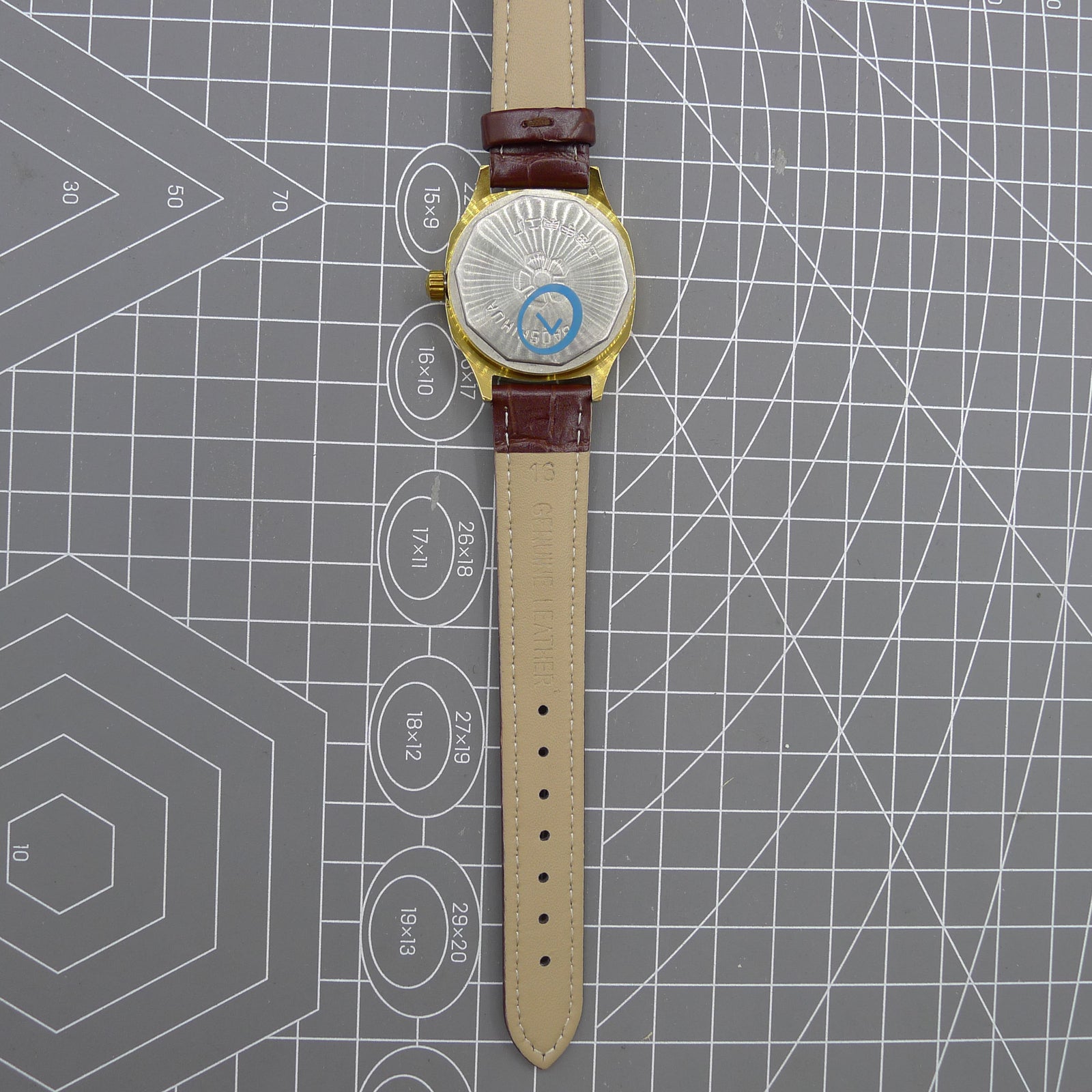 Shanghai 33mm manual mechanical watch with blue dial, gold markers, square case, 17 jewels movement.