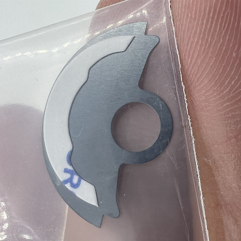 Waved blue metal sheet overlay for Miyota 9015 rotor, adding elegant detail to watch movement design.