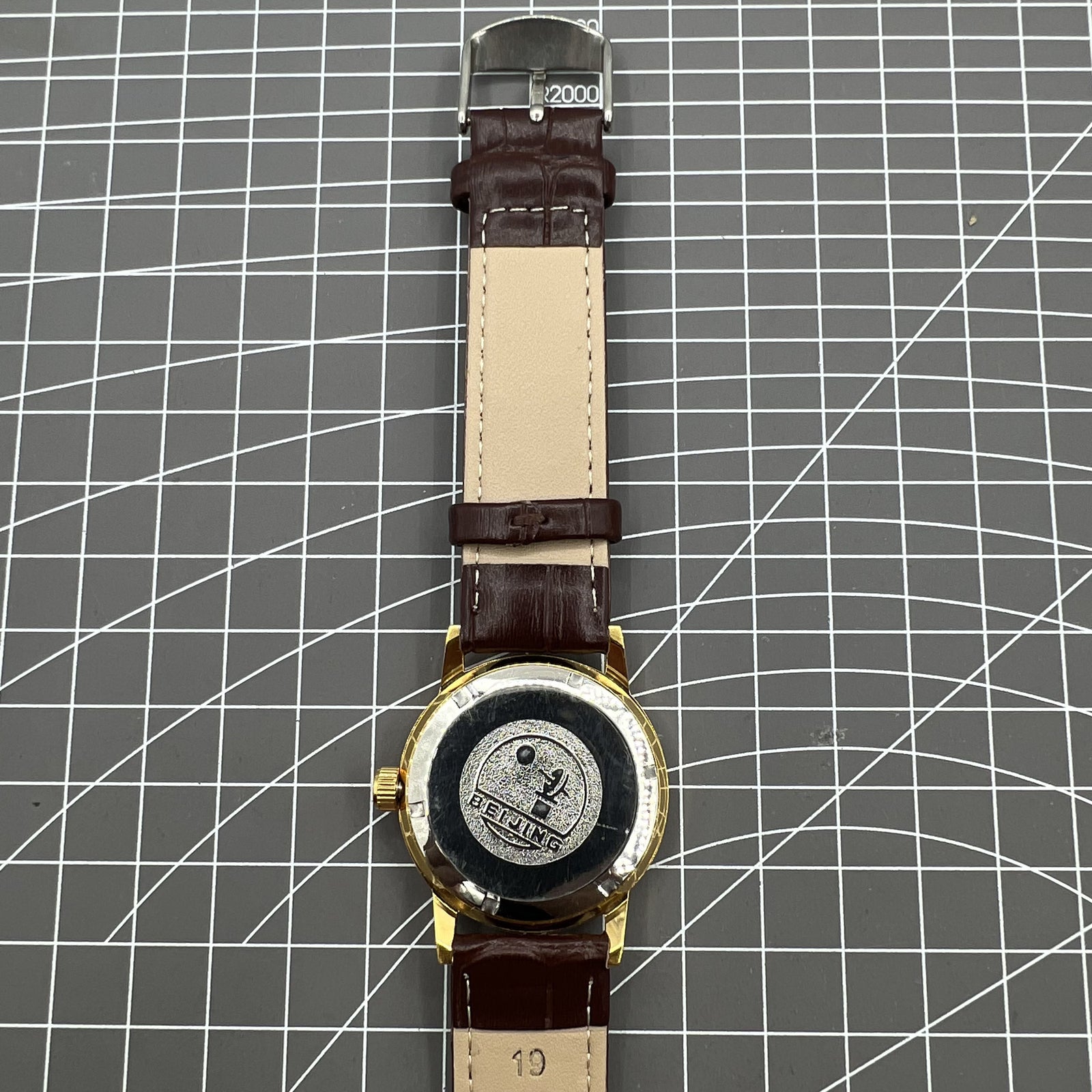 Beijing Double Rhomb manual watch with gold case, silver markers, classic elegant design for wrist accessory