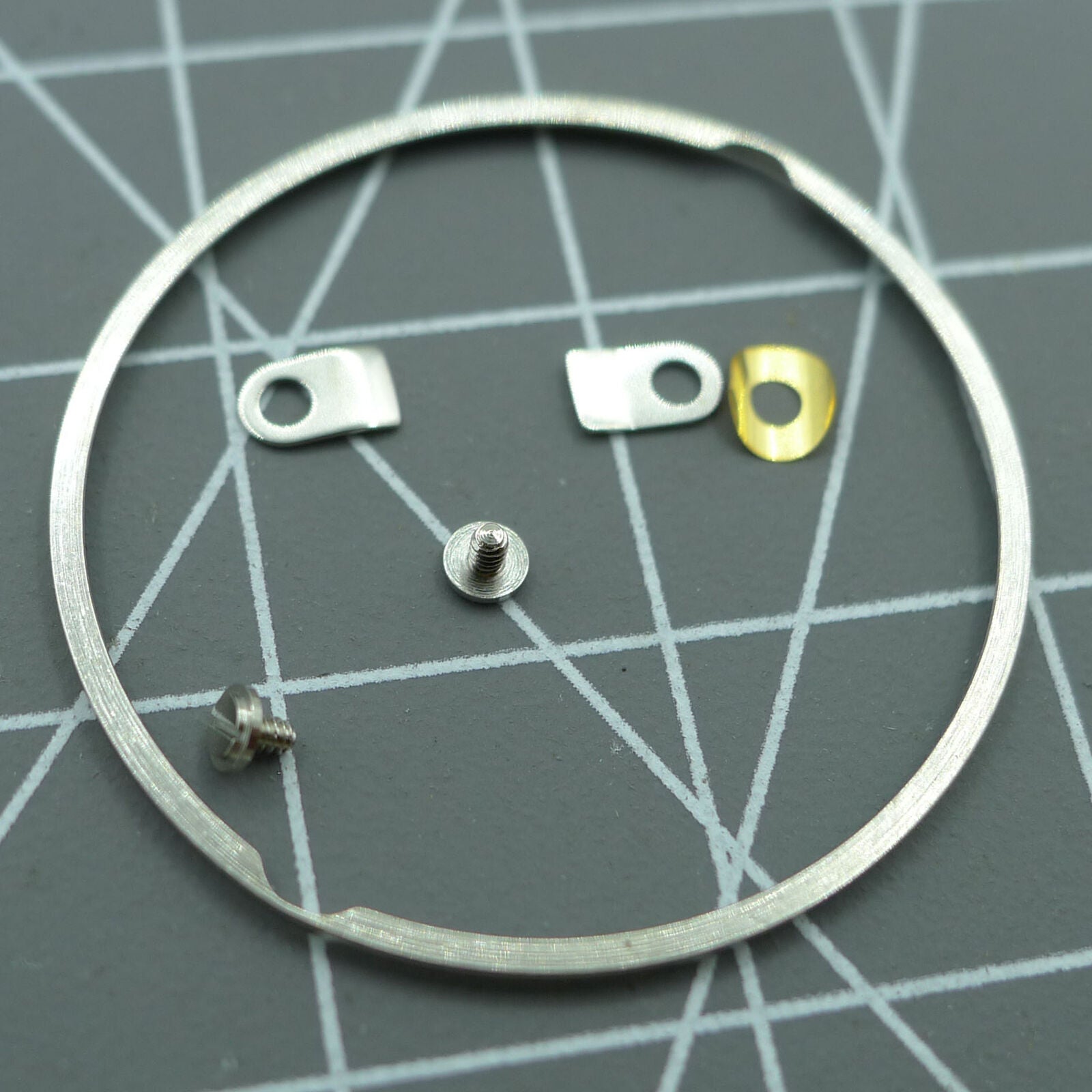 Case cushion mount spacer ring with screws and clamps for ETA2824 2836 watch movements.