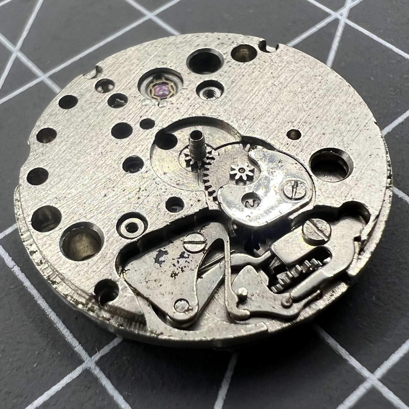 China Made 7121 3121 automatic mechanical watch movement showing precise internal components for repair practice.