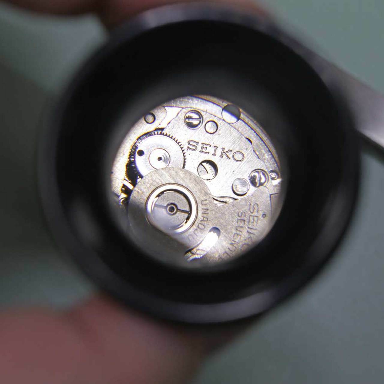 Bergeon 2611-TN-1.5 watchmaker loupe with 6.7x magnification and built-in opening tool for precise watch accessory repairs