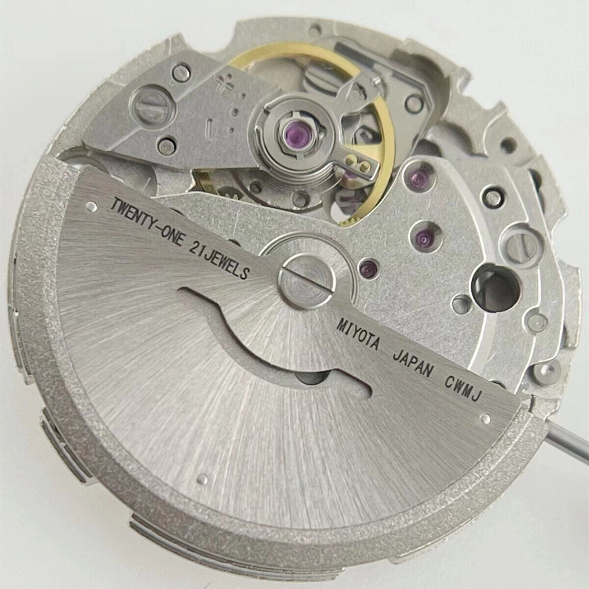 Miyota/Citizen 8215 automatic watch movement with white dial and date window at 6 o'clock for precise timekeeping.