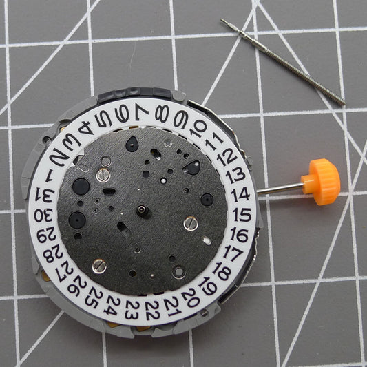 Japan Miyota JP11 quartz watch movement with date display at 3 o'clock, precision timekeeping.