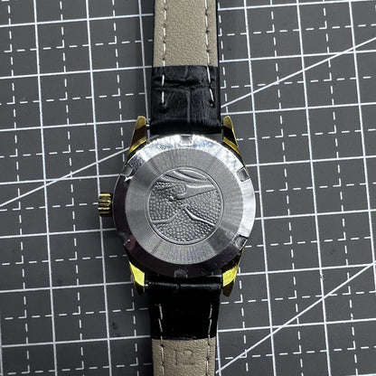 Black round case ladies watch with golden markers, Tianjin Seagull manual movement, elegant accessory for formal wear.