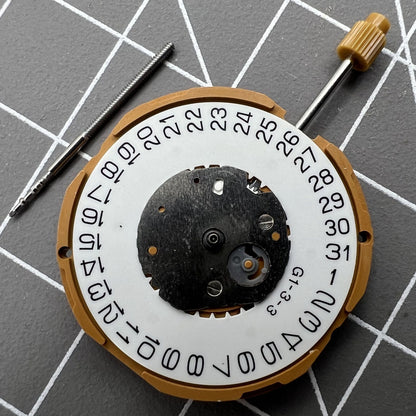 Miyota GM10 quartz watch movement showing date display at 3 o'clock, Japan-made precision mechanism for accurate timekeeping