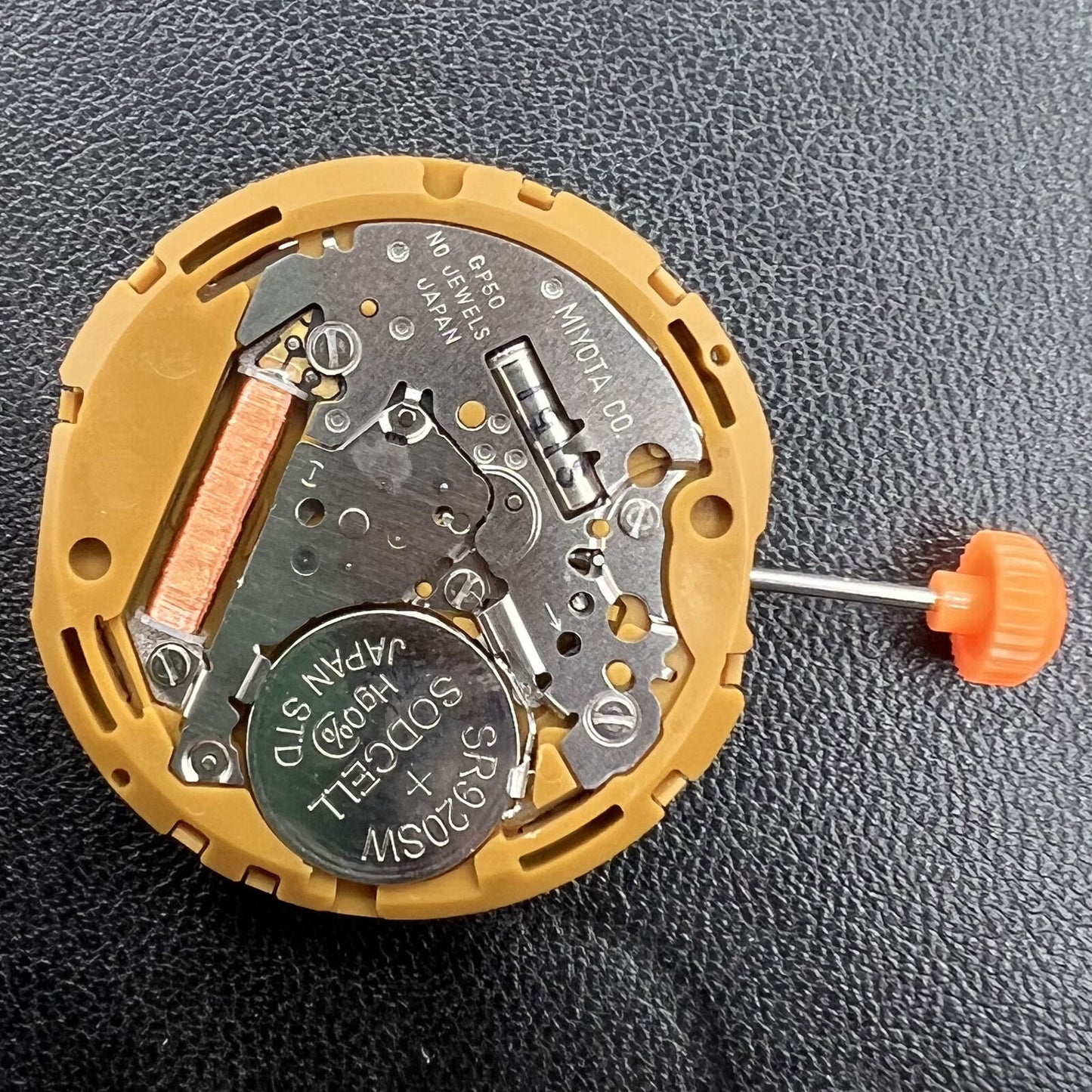 Miyota GP50 quartz watch movement showing precise timekeeping mechanism for watch repairs.