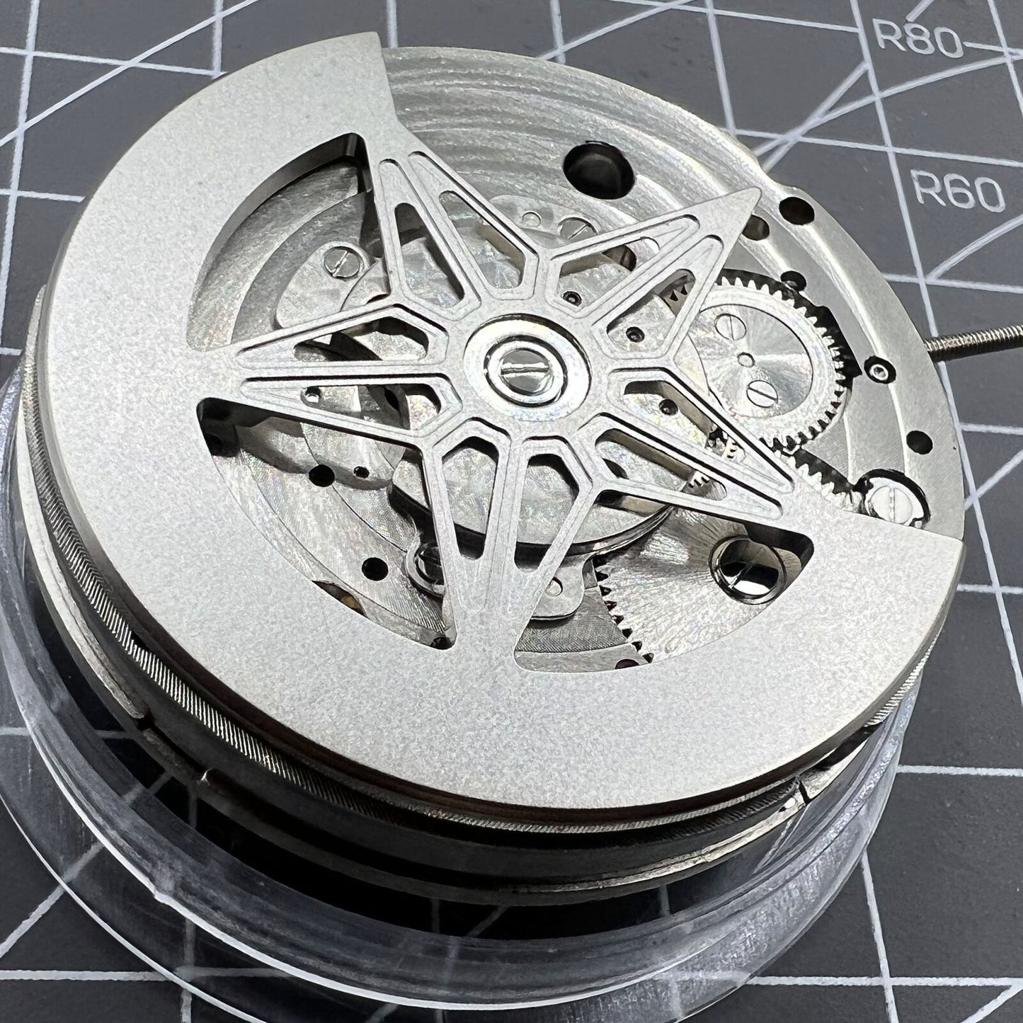 Dandong Silver watch featuring hollow star moon phase and automatic mechanical movement, elegant accessory.