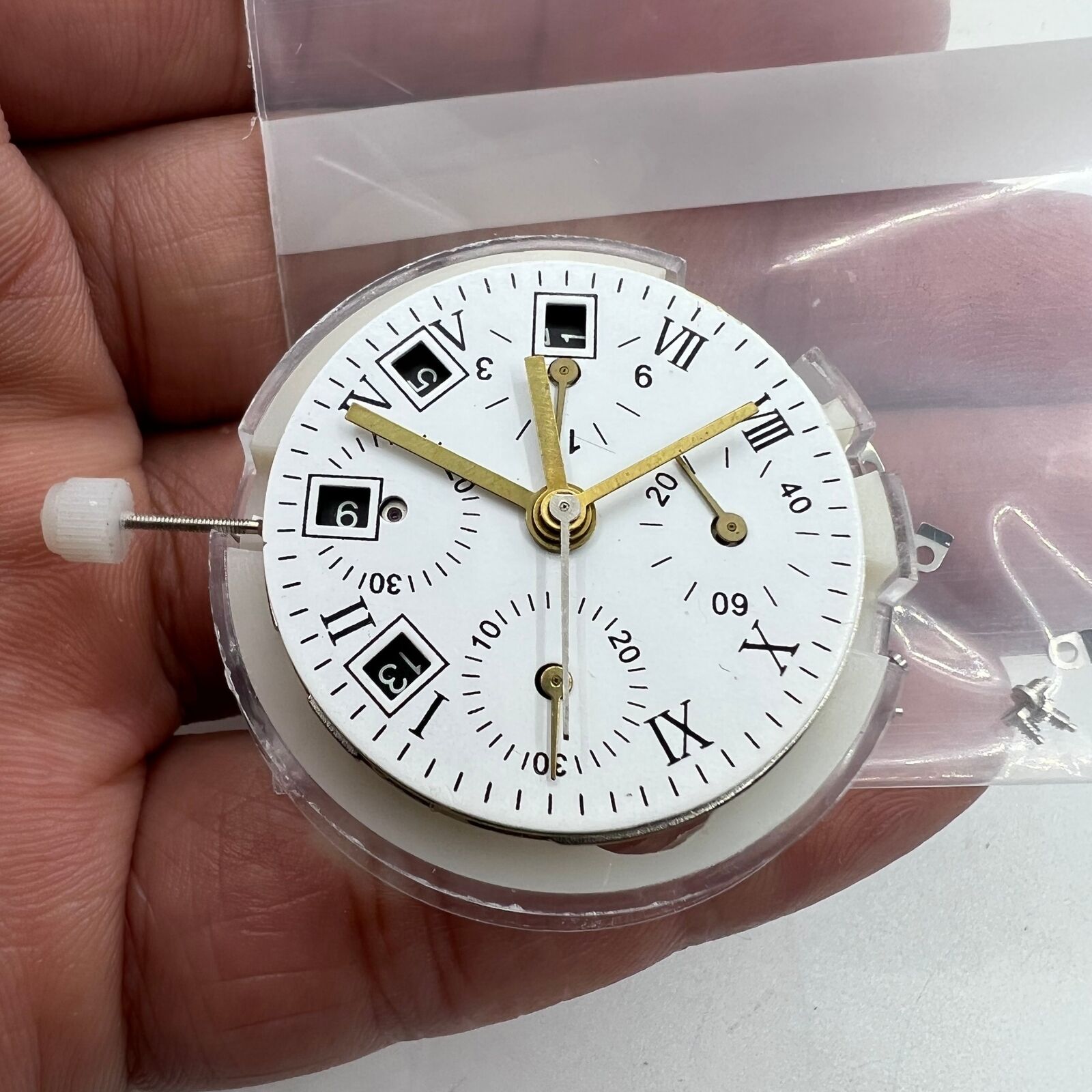 Black dial ETA 7750 chronograph watch, Swiss movement, single calendar, sleek sporty design.