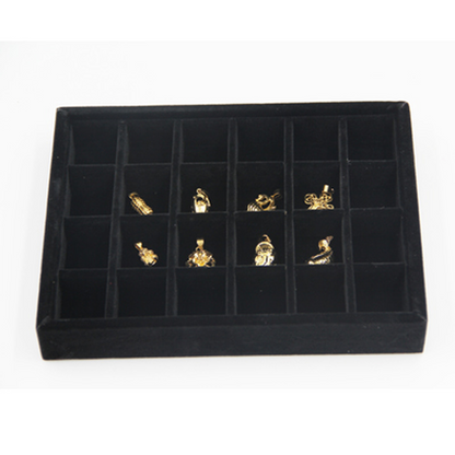 Gray velvet stackable jewelry organizer tray with grid compartments for elegant accessory storage.