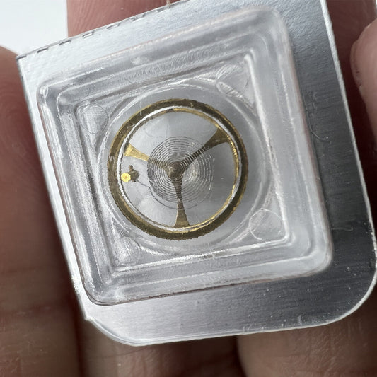 Golden complete balance wheel with hairspring for Orient 46941 46943 watch movement, precision component by Orient.