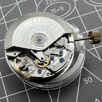 Dandong 7750 mechanical watch movement with black dial, small seconds at 6 o'clock, date window, watch accessory.