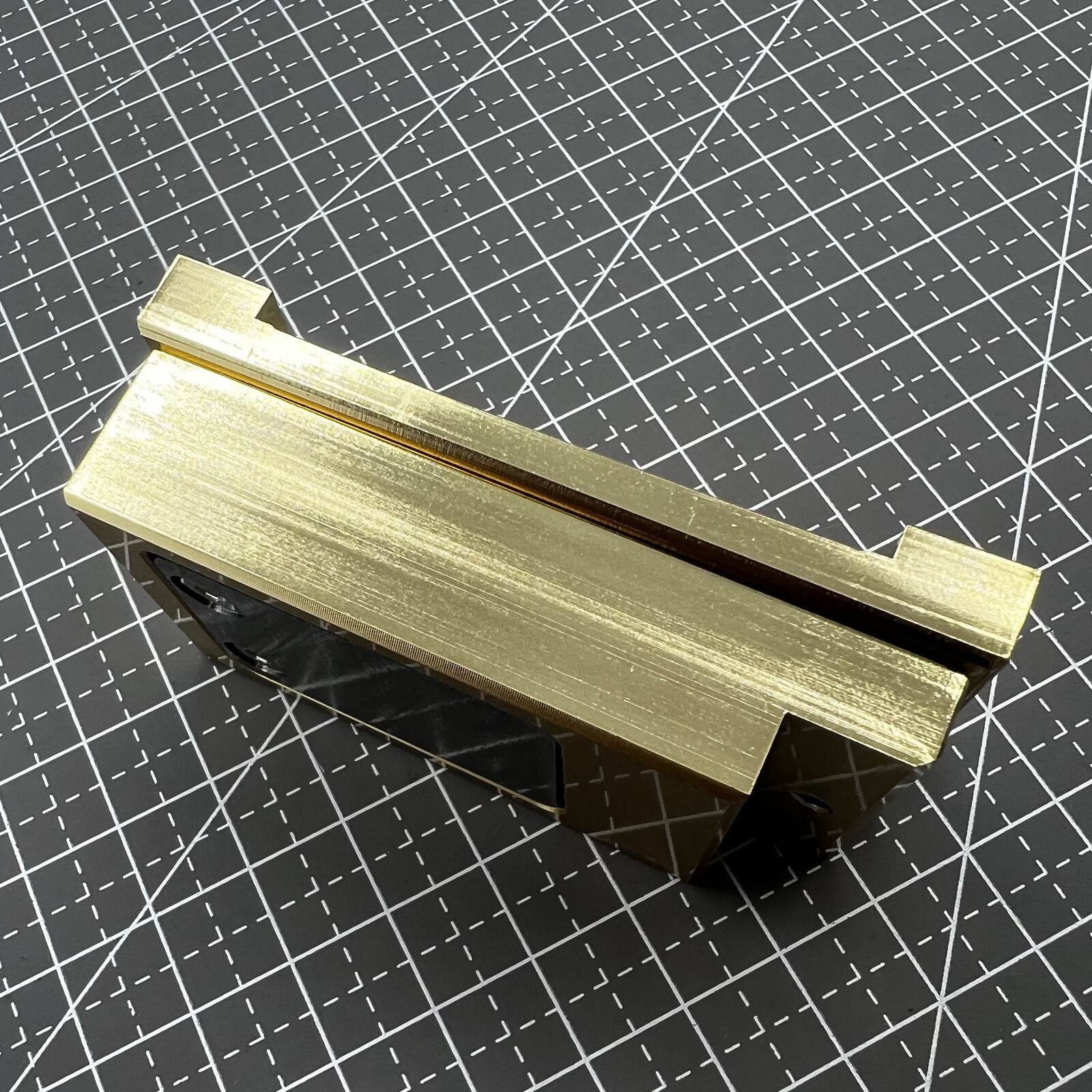 Brass-handled stainless steel pegwood tool by Woodcutter for precise watch detailing and cleaning.