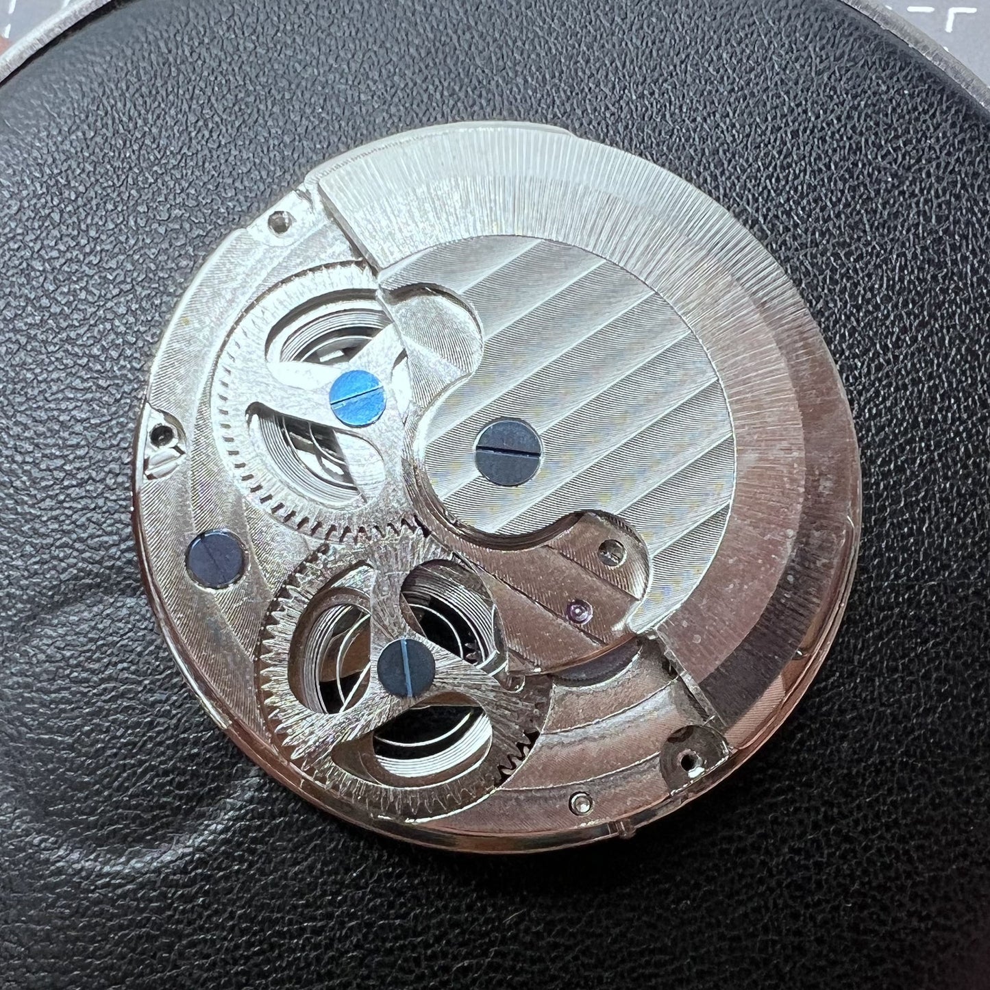 Small silver hollow watch movement with double mainspring and balance wheel at 6 o?clock by Kleines brand.