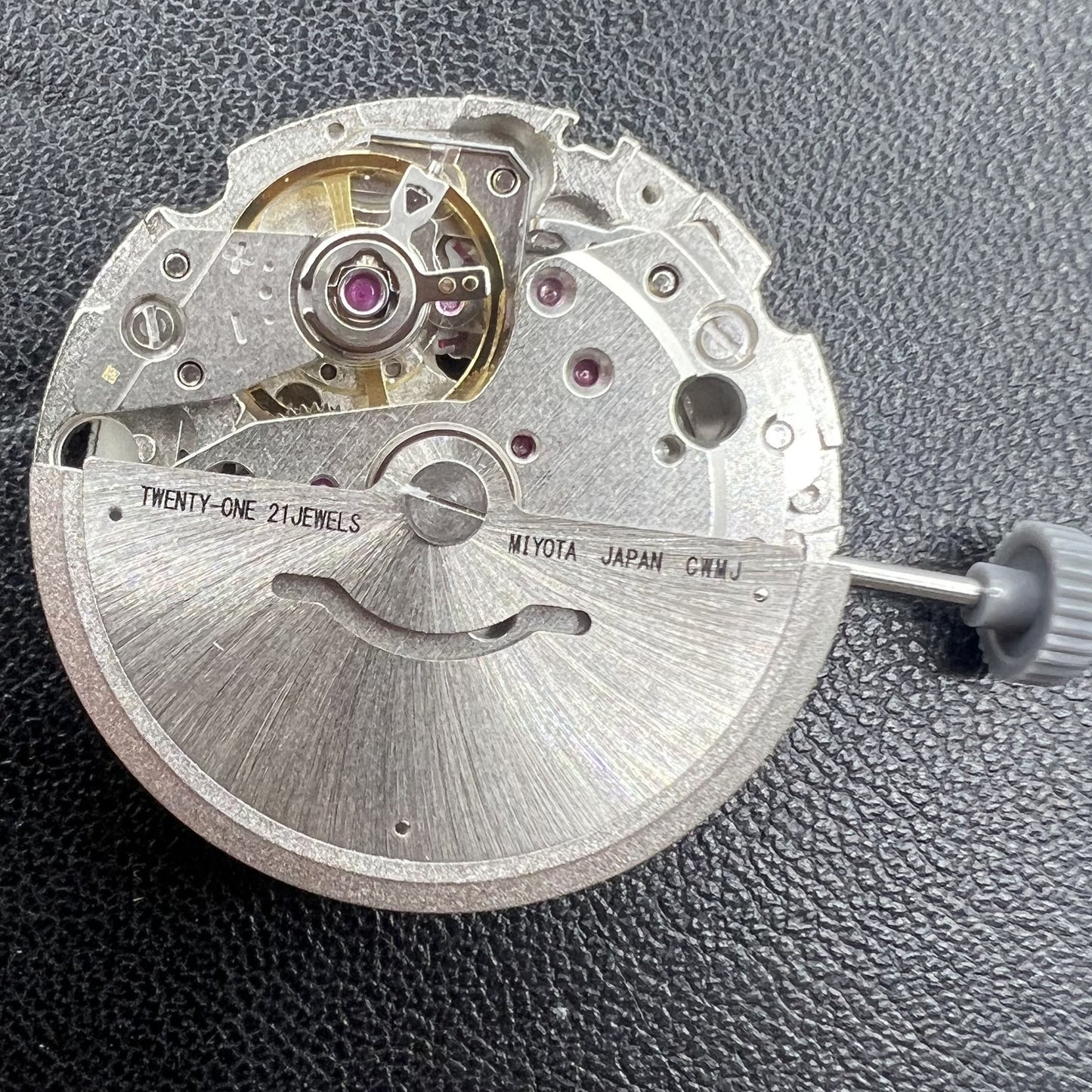 Citizen Miyota 8215 automatic mechanical watch movement with black dial and date display at 3 o'clock.