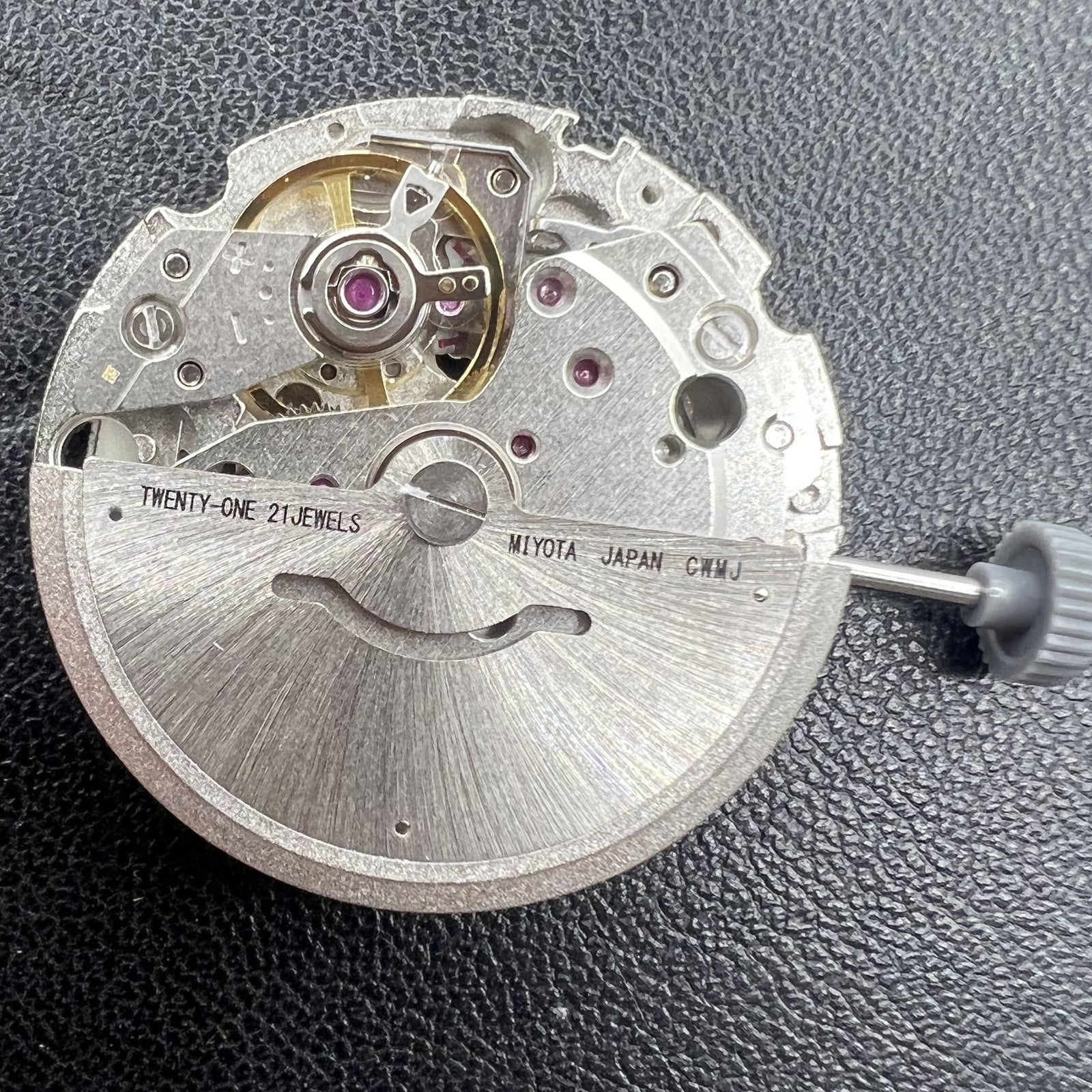 Citizen Miyota 8215 automatic mechanical watch movement with black dial and date display at 3 o'clock.