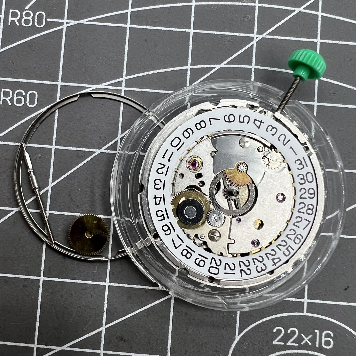 ETA 2824-2 Swiss mechanical movement close-up showing intricate watch mechanism details.