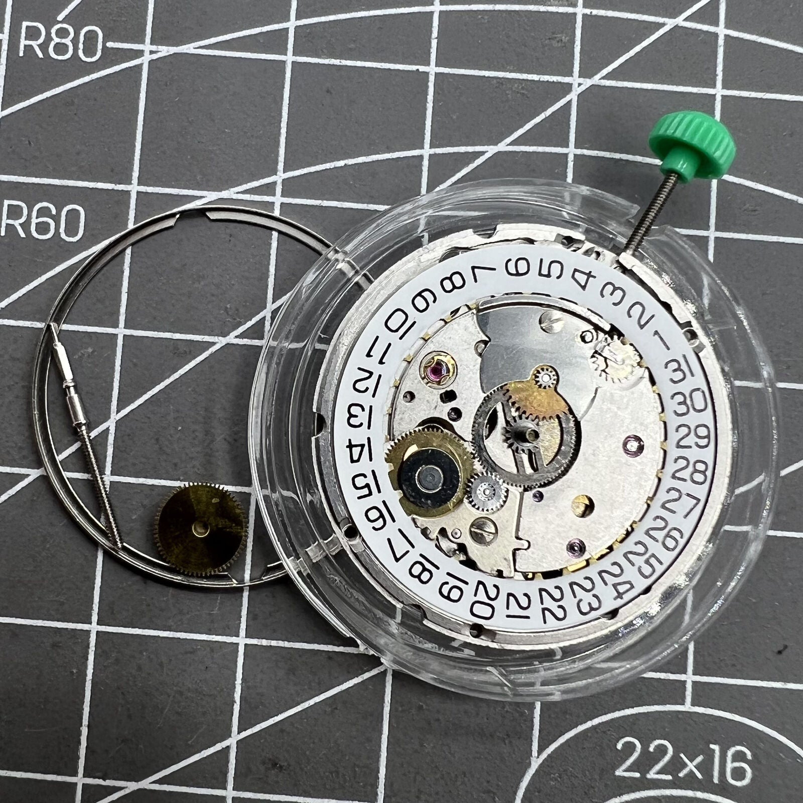 ETA 2824-2 Swiss mechanical movement close-up showing intricate watch mechanism details.