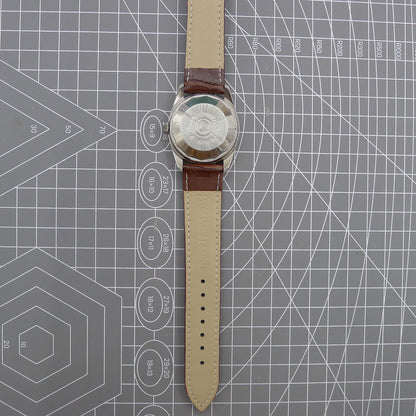 Dandong Peacock 37mm manual watch with golden dial, single calendar, 33 jewels, elegant style for formal wear.