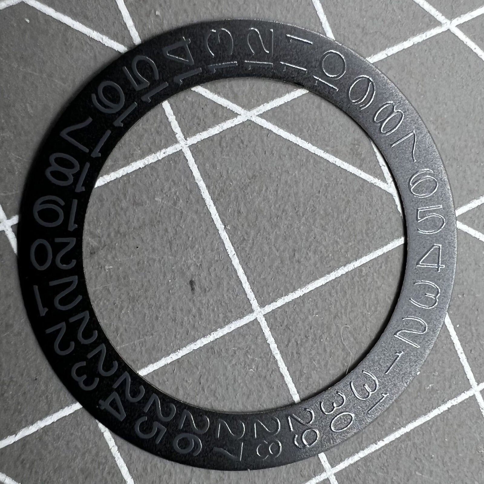 Grey date wheel for NH35 NH36 watch movement, black background, precise date display component.