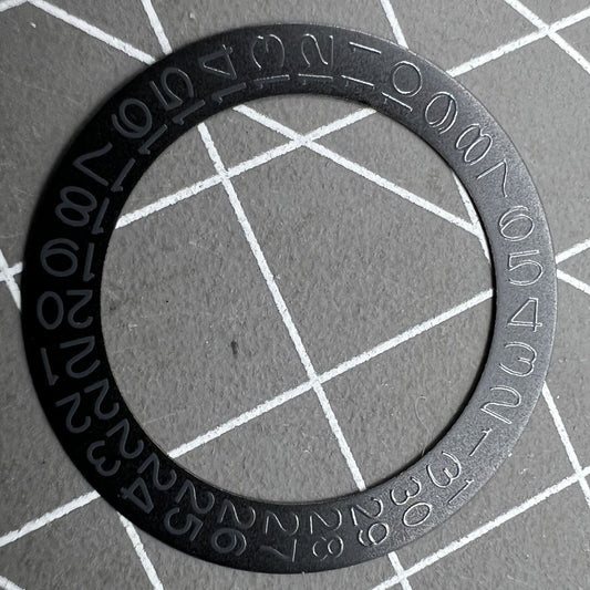 Grey date wheel for NH35 NH36 watch movement, black background, precise date display component.