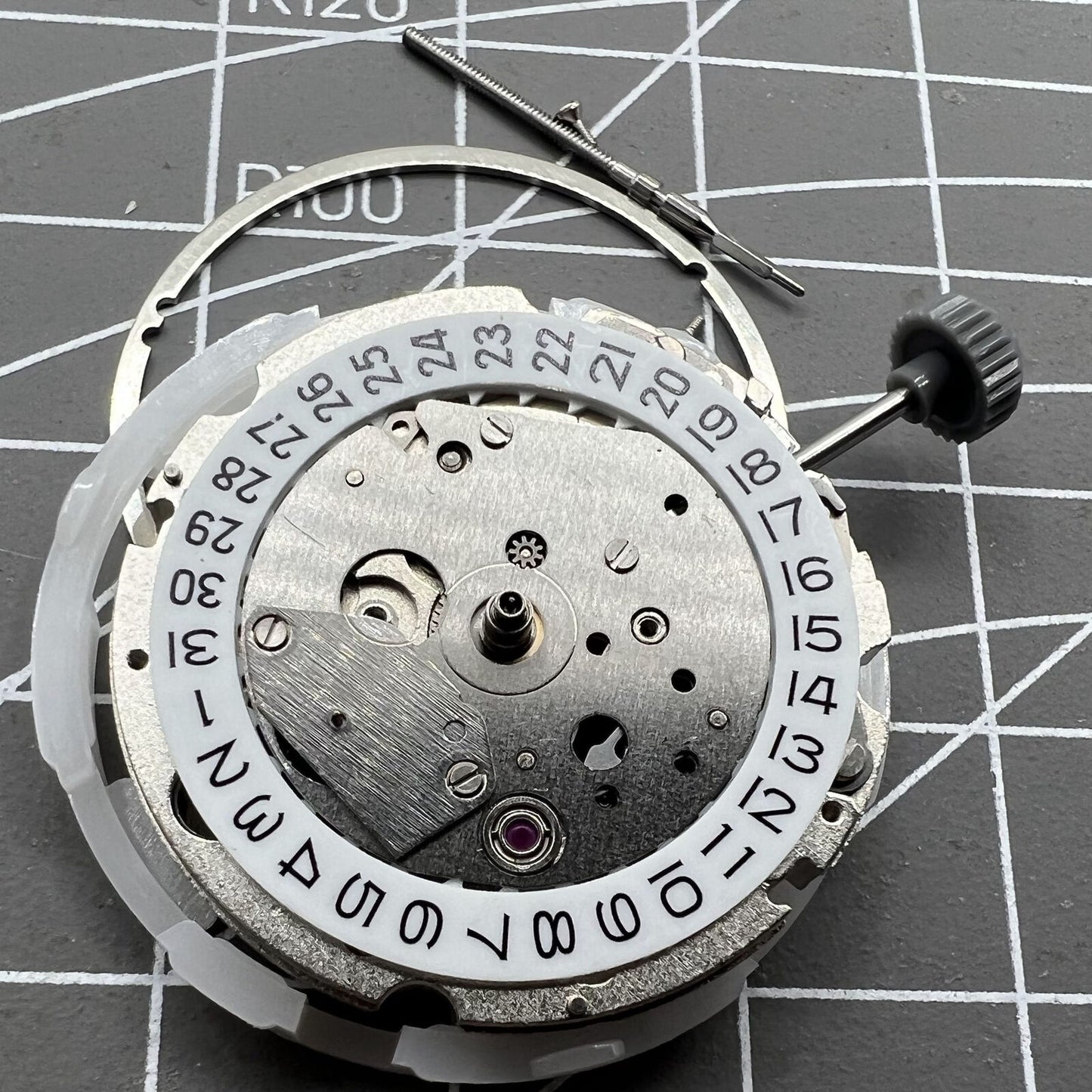 Miyota 8217 automatic watch movement displaying hour, minute, and small second hand at 9 o'clock position for precision timekeeping.