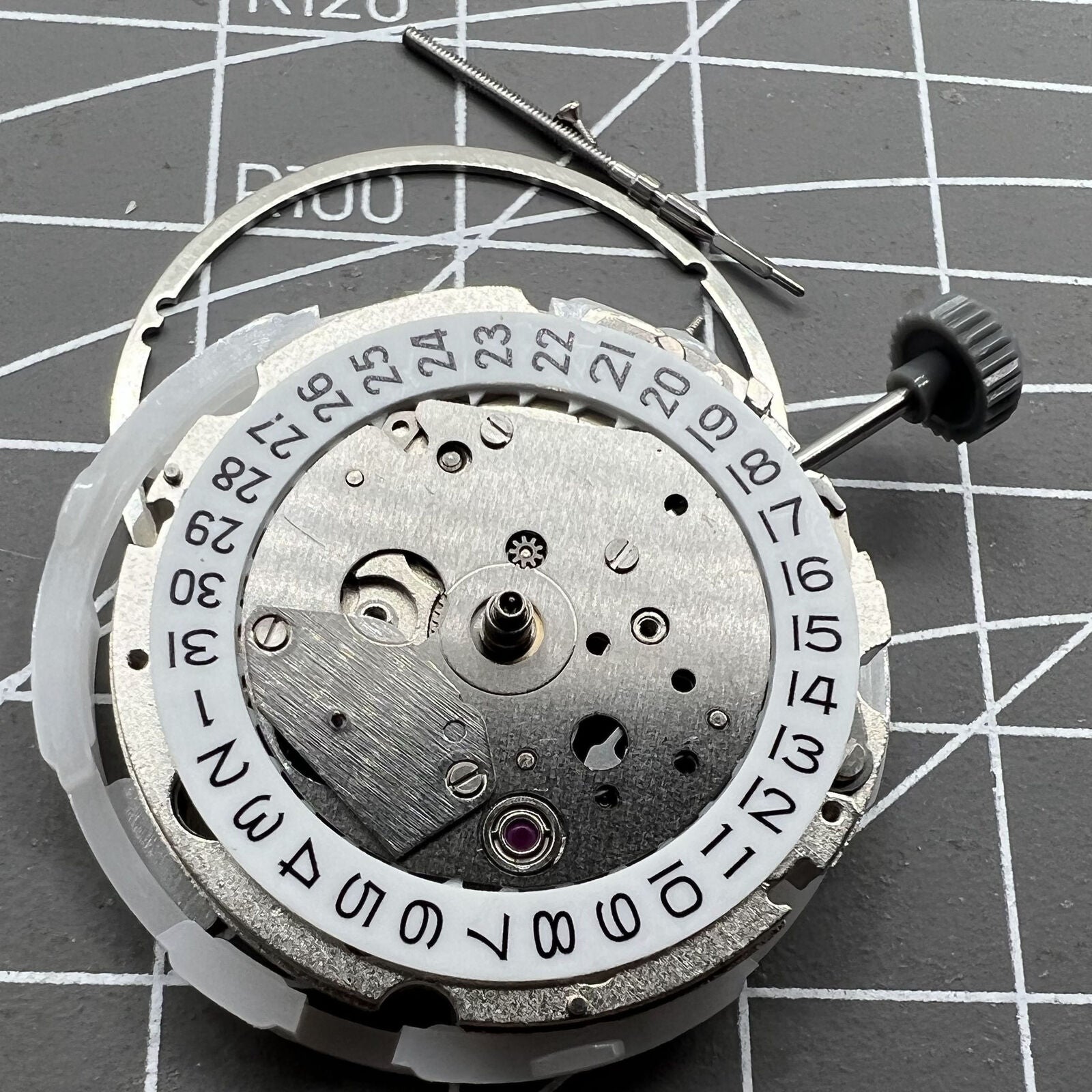 Miyota 8217 automatic watch movement displaying hour, minute, and small second hand at 9 o'clock position for precision timekeeping.