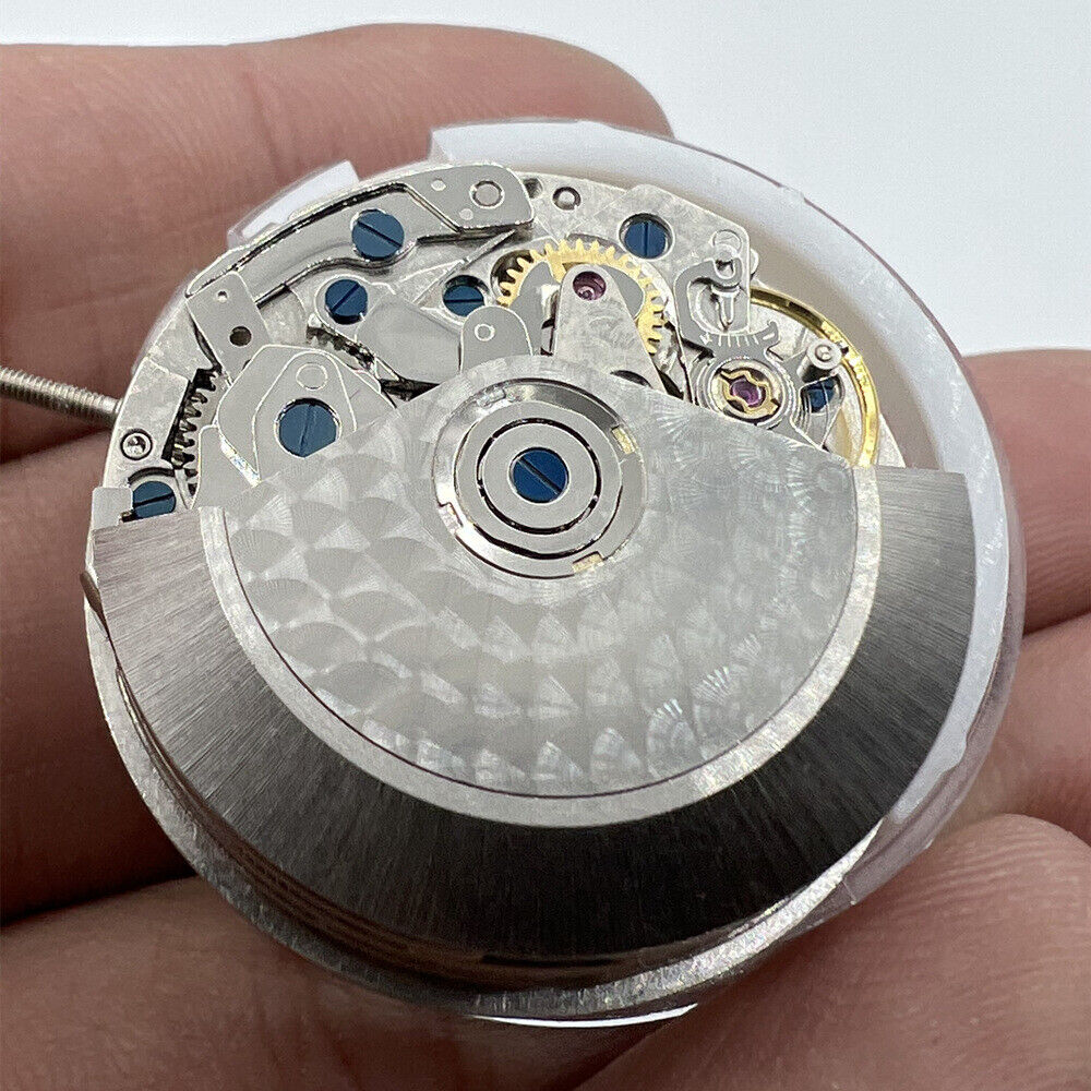 Close-up of Asian 7750 automatic chronograph movement with single calendar at 6 o'clock and seconds at 9, ETA 7750 style.