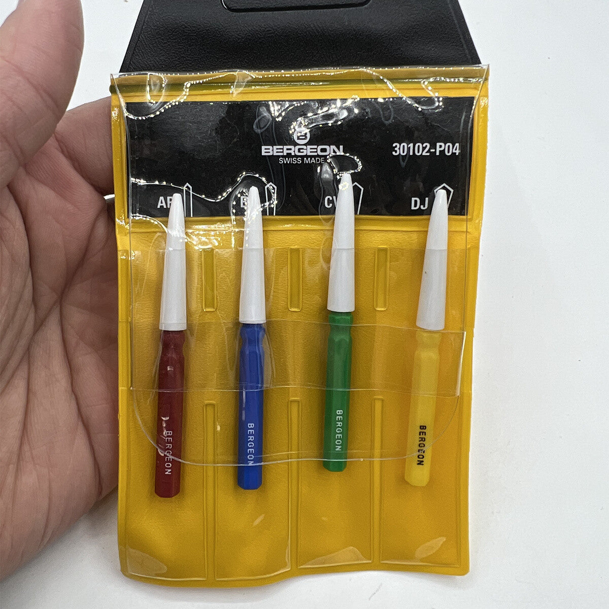 Bergeon 30102-P04 watch dip oiler set, four precision tools for accurate oil application.