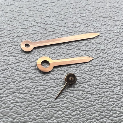 Rose gold arrow-shaped watch hands set for Miyota 1L45, stylish trim detail.