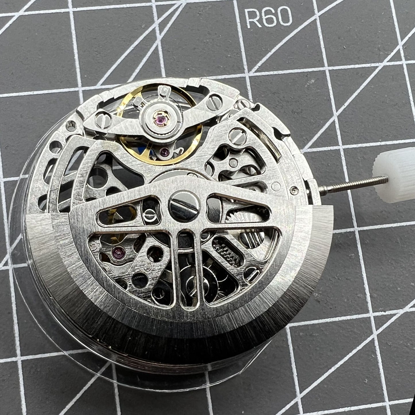 Asian HZ75DOA silver hollow balance wheel displaying automatic mechanical movement detail for watch enthusiasts.