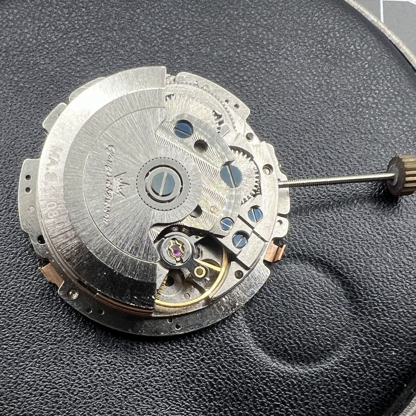 Hangzhou Made 2824 Big Date automatic watch movement highlighting detailed gears and precision craftsmanship.